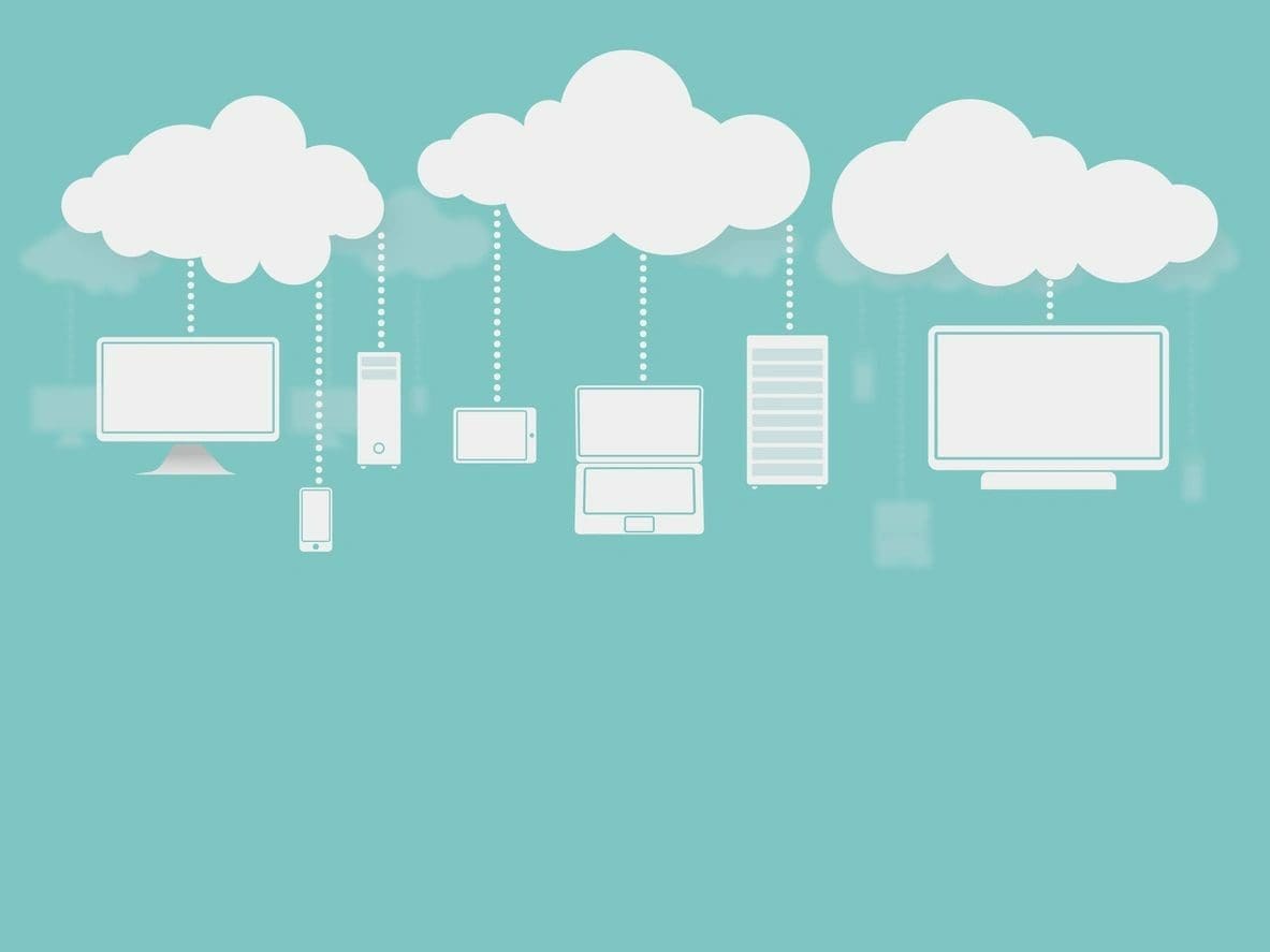 A bunch of computers hanging from the clouds